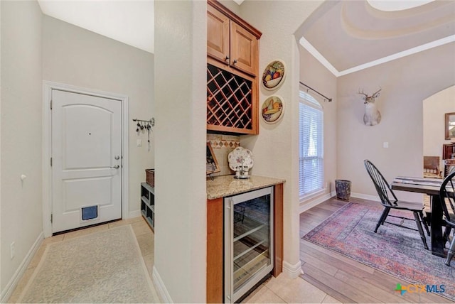 10510 Teich Loop, New Braunfels, TX 78132 - bar with beverage cooler, a dry bar, baseboards, and arched walkways