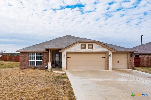 4505 Prewitt Ranch Rd, Killeen, TX 76549 - single story home featuring a garage, concrete driveway, roof with shingles, and brick siding