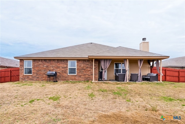 4505 Prewitt Ranch Rd, Killeen, TX 76549 - back of house featuring a fenced backyard, a chimney, and roof with shingles