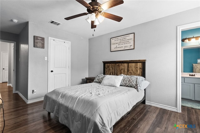 4505 Prewitt Ranch Rd, Killeen, TX 76549 - bedroom with dark wood-type flooring, connected bathroom, and a ceiling fan