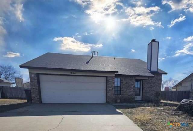 single story home with a garage