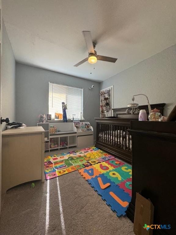 carpeted bedroom featuring ceiling fan