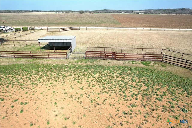 exterior space featuring an outbuilding and a rural view