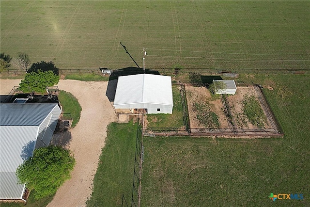 birds eye view of property with a rural view