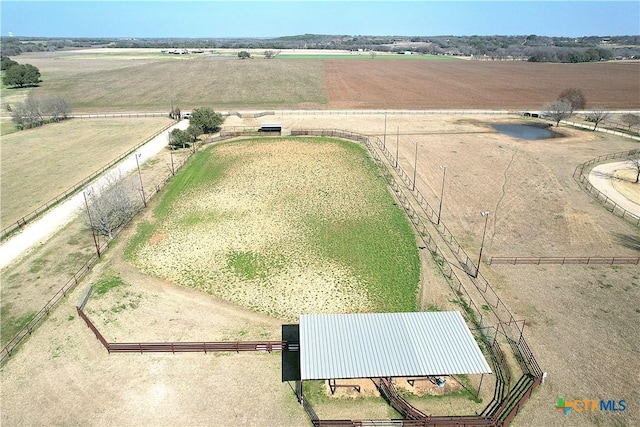 birds eye view of property with a rural view