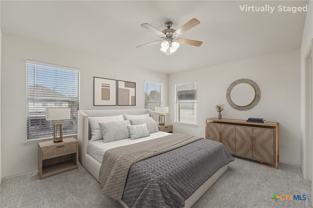 carpeted bedroom with a ceiling fan