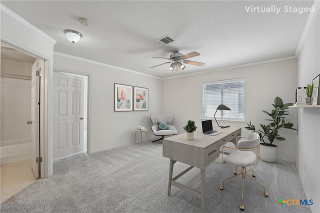 home office featuring visible vents, crown molding, and carpet