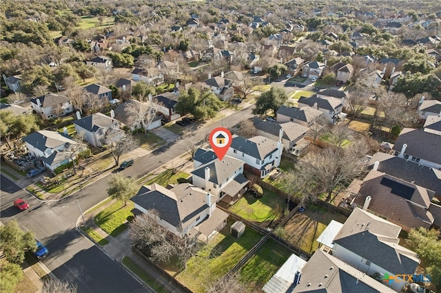 birds eye view of property with a residential view