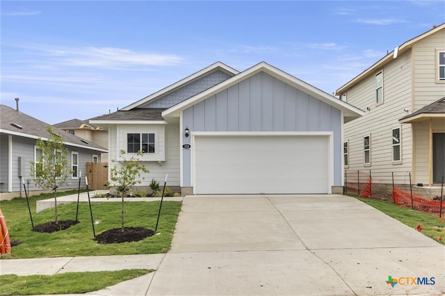 view of front facade with a garage and a front lawn