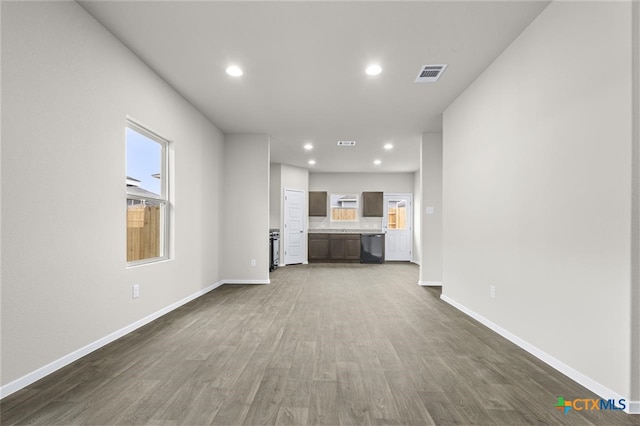 unfurnished living room with dark hardwood / wood-style flooring