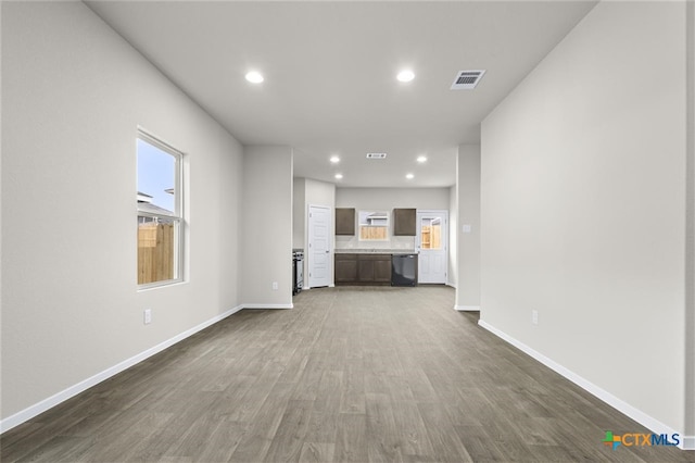 124 Linnet Ln, Maxwell, TX 78656 - unfurnished living room featuring plenty of natural light, dark wood finished floors, and recessed lighting