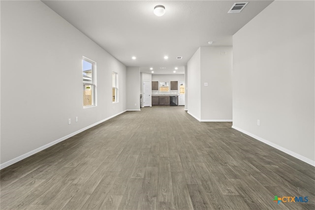 unfurnished living room with dark hardwood / wood-style floors