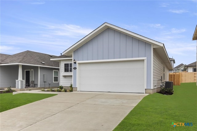 view of front facade with central AC unit, a garage, and a front lawn