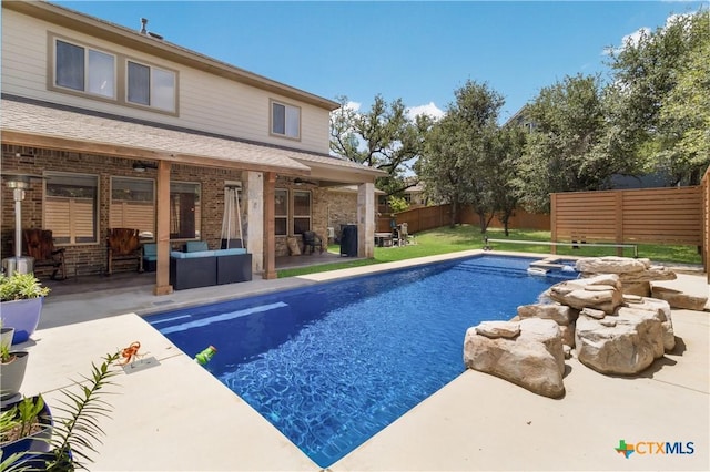 29121 Ismorada, San Antonio, TX 78260 - view of pool featuring a fenced backyard, a patio area, a pool with connected hot tub, and an outdoor living space