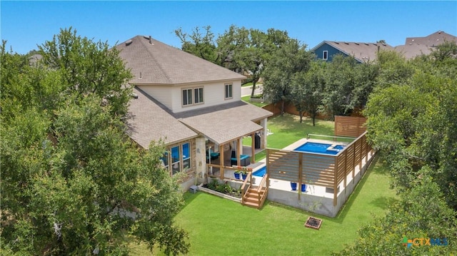 29121 Ismorada, San Antonio, TX 78260 - rear view of house with a shingled roof, a yard, and an outdoor pool