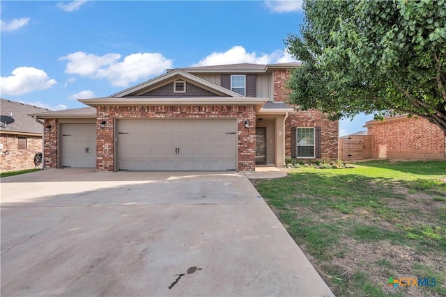 2506 Alamocitos Creek Dr, Killeen, TX 76549 - view of front of house with brick siding, concrete driveway, and a garage