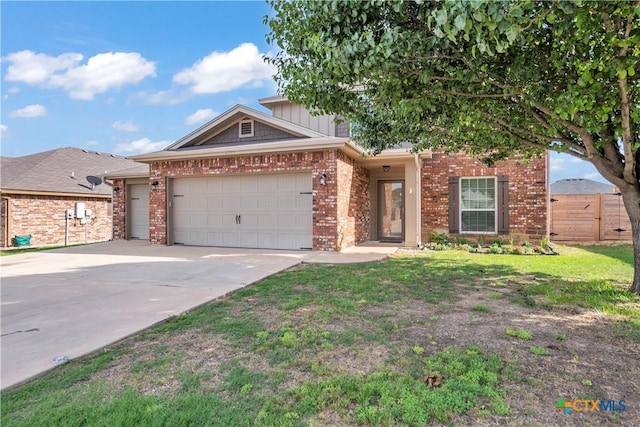 2506 Alamocitos Creek Dr, Killeen, TX 76549 - view of front facade with fence, brick siding, a garage, and driveway