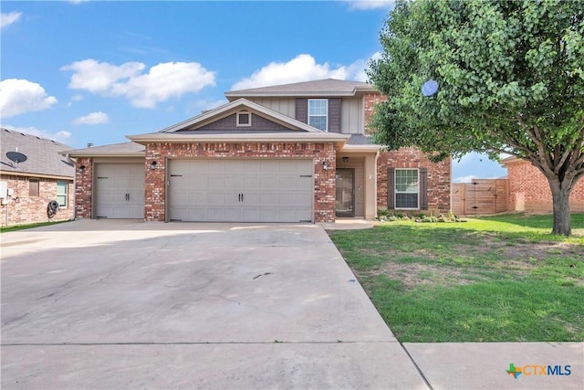 2506 Alamocitos Creek Dr, Killeen, TX 76549 - traditional-style home featuring concrete driveway, an attached garage, and brick siding