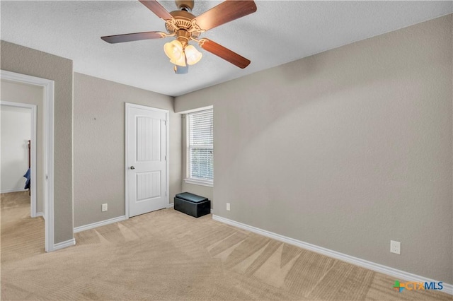 2506 Alamocitos Creek Dr, Killeen, TX 76549 - unfurnished bedroom featuring light carpet, baseboards, and a ceiling fan
