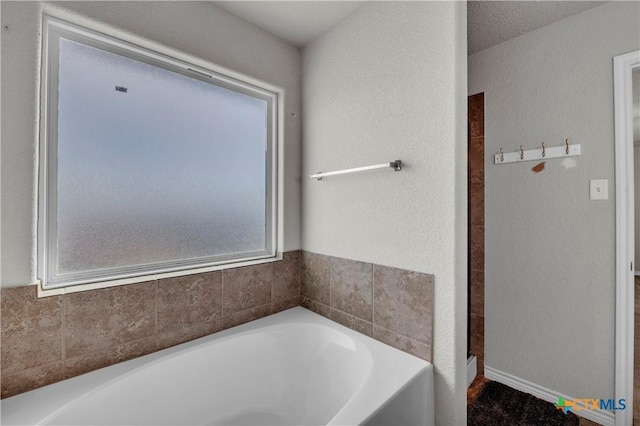 2506 Alamocitos Creek Dr, Killeen, TX 76549 - full bathroom featuring a bath and a textured wall