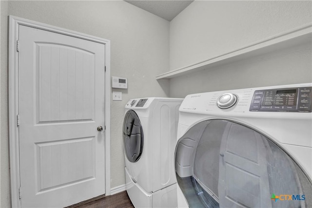 2506 Alamocitos Creek Dr, Killeen, TX 76549 - laundry room with independent washer and dryer, dark wood-style flooring, and baseboards