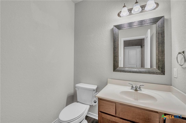 2506 Alamocitos Creek Dr, Killeen, TX 76549 - bathroom featuring a textured wall, toilet, vanity, and baseboards