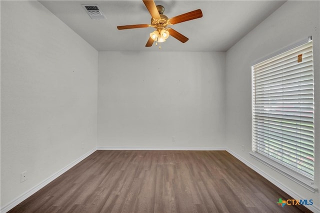 2506 Alamocitos Creek Dr, Killeen, TX 76549 - empty room featuring dark wood-style floors, ceiling fan, and baseboards