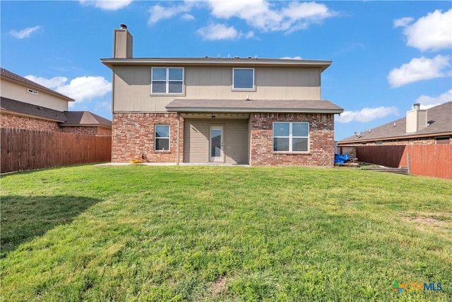 2506 Alamocitos Creek Dr, Killeen, TX 76549 - rear view of property with brick siding and a chimney