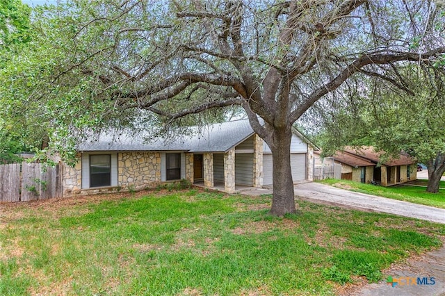 14311 Arrowood, San Antonio, TX 78233 - mid-century modern home with stone siding, concrete driveway, and a garage