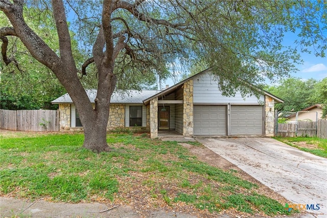 14311 Arrowood, San Antonio, TX 78233 - mid-century modern home with stone siding, a garage, and concrete driveway