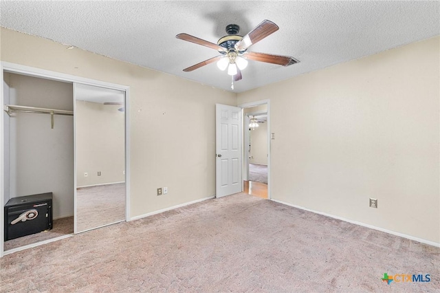 14311 Arrowood, San Antonio, TX 78233 - unfurnished bedroom with carpet, a textured ceiling, a closet, and ceiling fan
