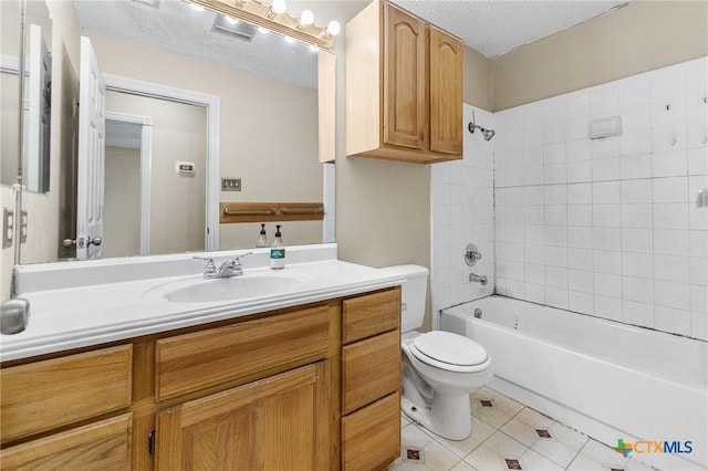 14311 Arrowood, San Antonio, TX 78233 - bathroom featuring vanity, tile patterned flooring, washtub / shower combination, and a textured ceiling
