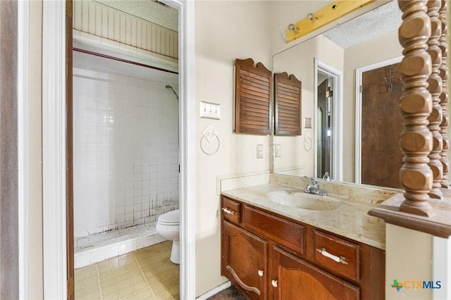 14311 Arrowood, San Antonio, TX 78233 - full bathroom with a tile shower, vanity, and tile patterned flooring