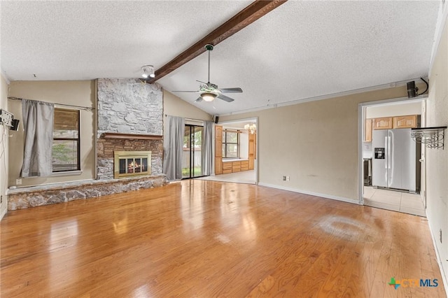 14311 Arrowood, San Antonio, TX 78233 - unfurnished living room featuring a textured ceiling, ceiling fan, healthy amount of natural light, and light wood-style flooring