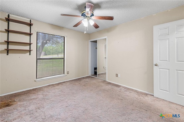 14311 Arrowood, San Antonio, TX 78233 - unfurnished bedroom with carpet, a textured ceiling, and a ceiling fan