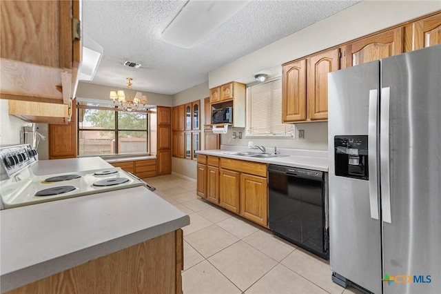 14311 Arrowood, San Antonio, TX 78233 - kitchen featuring black appliances, a textured ceiling, light tile patterned floors, a chandelier, and light countertops