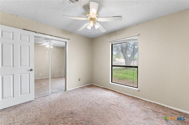 14311 Arrowood, San Antonio, TX 78233 - unfurnished bedroom featuring carpet, a textured ceiling, a closet, and ceiling fan