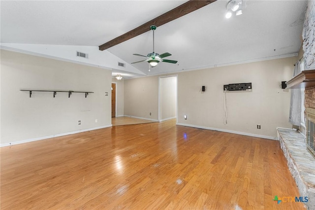 14311 Arrowood, San Antonio, TX 78233 - unfurnished living room with a glass covered fireplace, a ceiling fan, and light wood-style floors