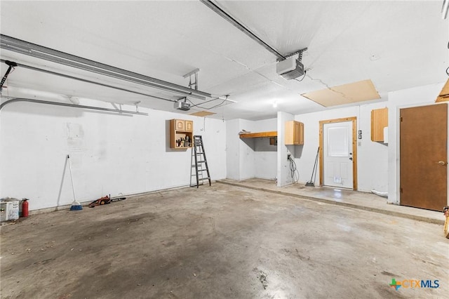 14311 Arrowood, San Antonio, TX 78233 - garage featuring a garage door opener