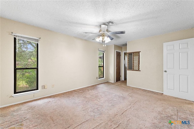 14311 Arrowood, San Antonio, TX 78233 - unfurnished bedroom with carpet, a textured ceiling, and ceiling fan