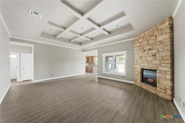 unfurnished living room featuring visible vents, dark wood finished floors, beam ceiling, baseboards, and coffered ceiling