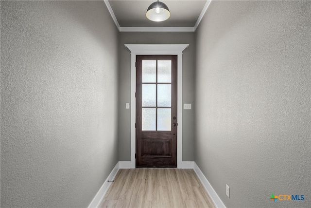101 Dana Point Rd, Lorena, TX 76655 - doorway with a textured wall, light wood-type flooring, baseboards, and crown molding