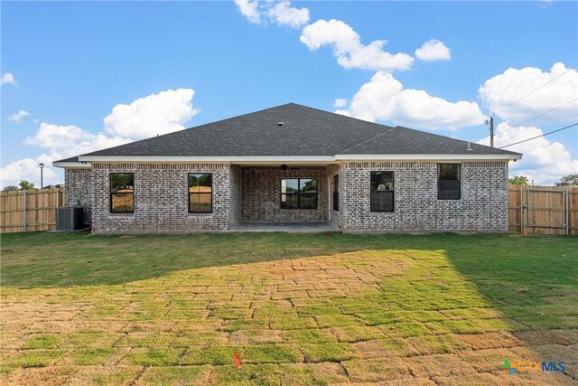 101 Dana Point Rd, Lorena, TX 76655 - back of house with brick siding, central AC, a patio area, and a shingled roof