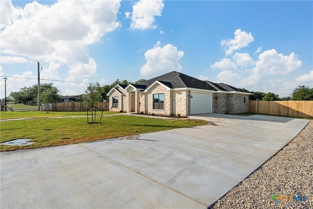 101 Dana Point Rd, Lorena, TX 76655 - ranch-style house with concrete driveway, brick siding, and an attached garage