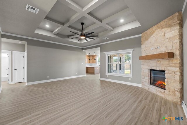 101 Dana Point Rd, Lorena, TX 76655 - unfurnished living room with a ceiling fan, baseboards, a fireplace, light wood-style floors, and coffered ceiling