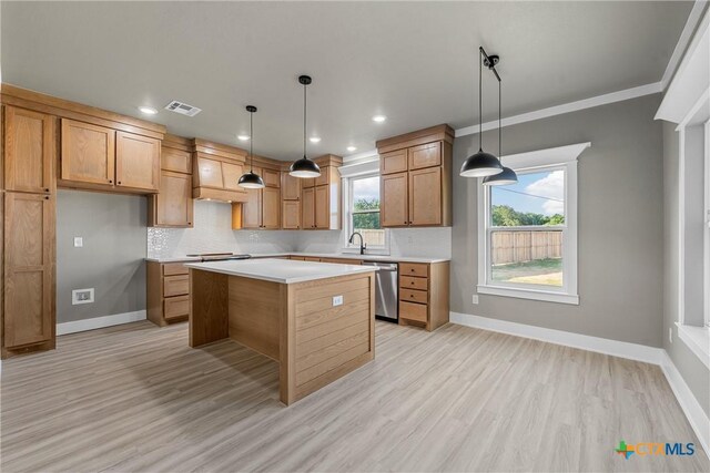 101 Dana Point Rd, Lorena, TX 76655 - kitchen with stainless steel dishwasher, baseboards, light countertops, light wood finished floors, and ornamental molding