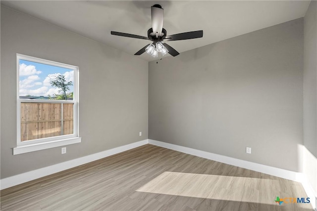 101 Dana Point Rd, Lorena, TX 76655 - spare room featuring wood finished floors, baseboards, and a ceiling fan