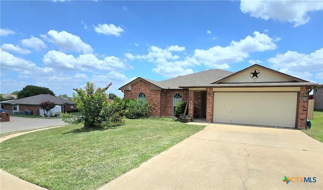 501 Mesquite Cir, Copperas Cove, TX 76522 - single story home with brick siding, a front yard, and an attached garage