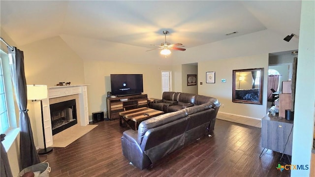 501 Mesquite Cir, Copperas Cove, TX 76522 - living area featuring vaulted ceiling, dark wood finished floors, ceiling fan, and a premium fireplace