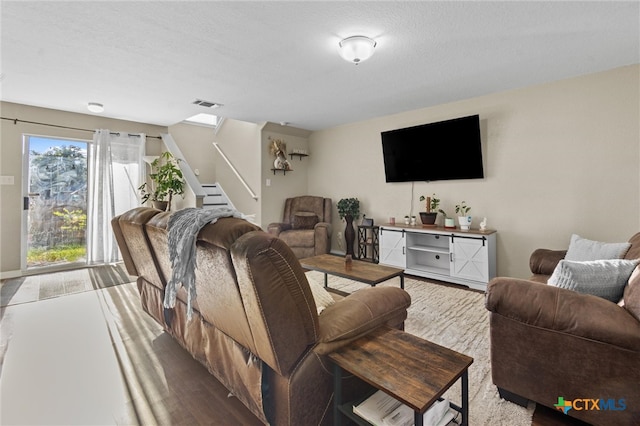 living room featuring a textured ceiling